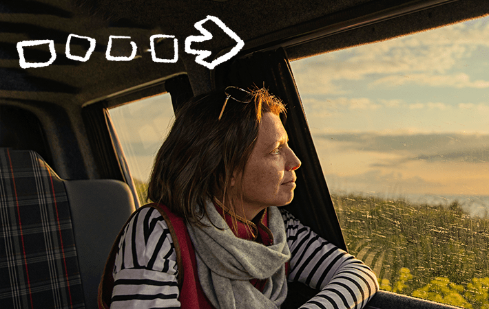 woman looking out the window while traveling (actor portrayal)