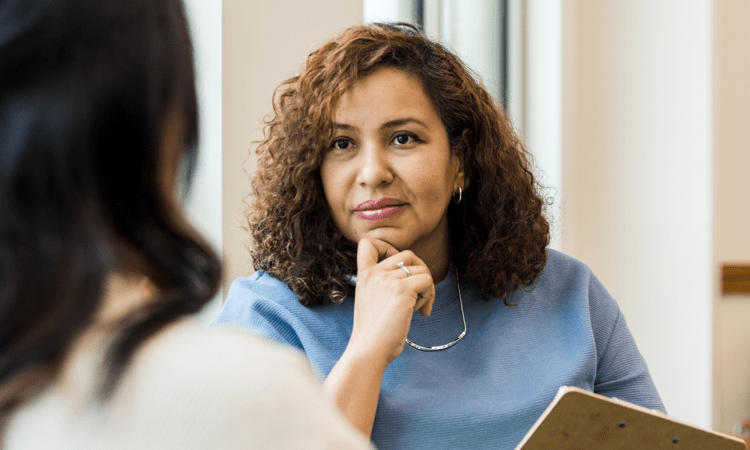 a woman listening attentively to the doctor (actor portrayal)