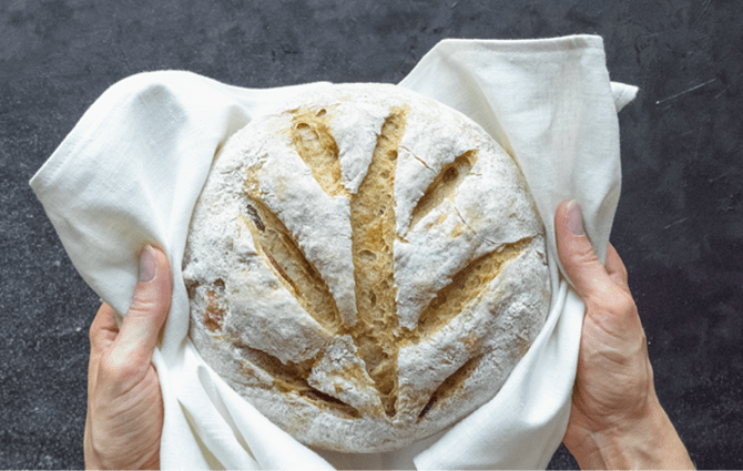 holding freshly baked bread