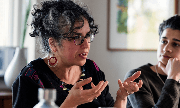 a woman suffering speaks candidly about her own experience (actor portrayal)