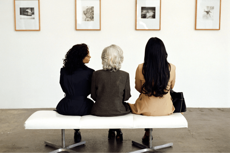 three beautiful women sitting together (actor portrayal)