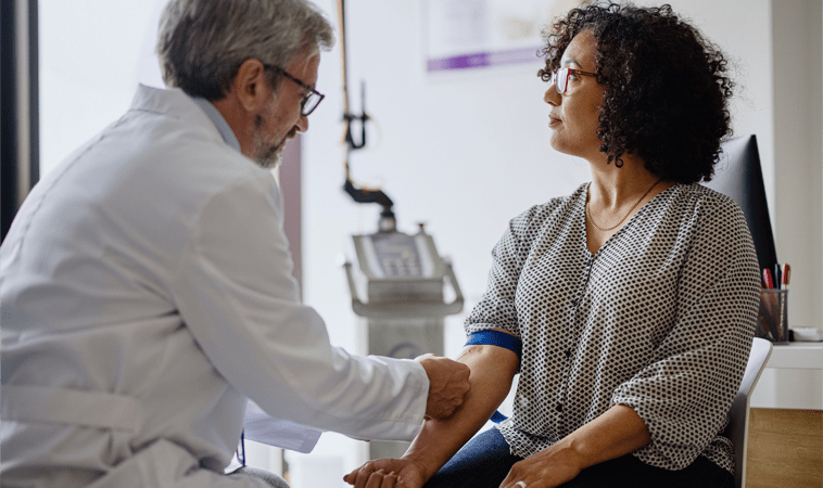 doctor's consultation with a woman about normal ALP levels as an important treatment goal in PBC (actor portrayal)